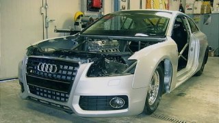 Illustration for article titled Watch an Audi A5 transform into a drag car